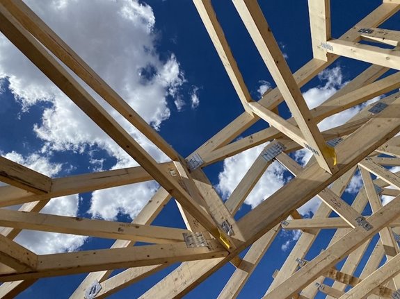 Another shot of the sky through the framing of a house.