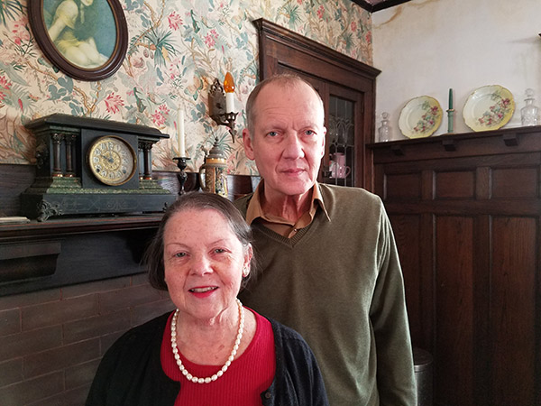 Tim Rinne & Kay Walter stand in their home