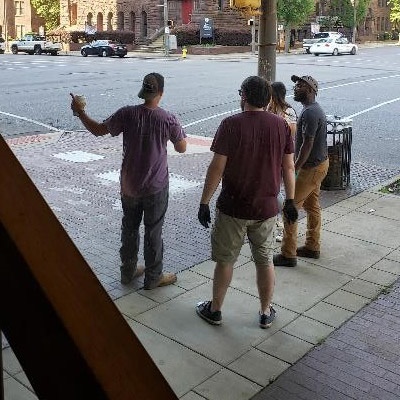 Kelliegh Gamble and his fraternity brothers work on clean-up.