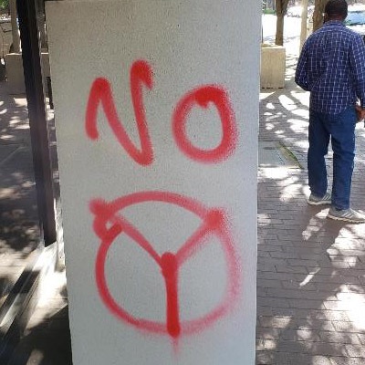 A sign saying "No Peace" is spray painted on the organization's building in Birmingham.