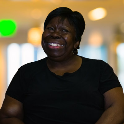 A New Orleans resident sits on a stage