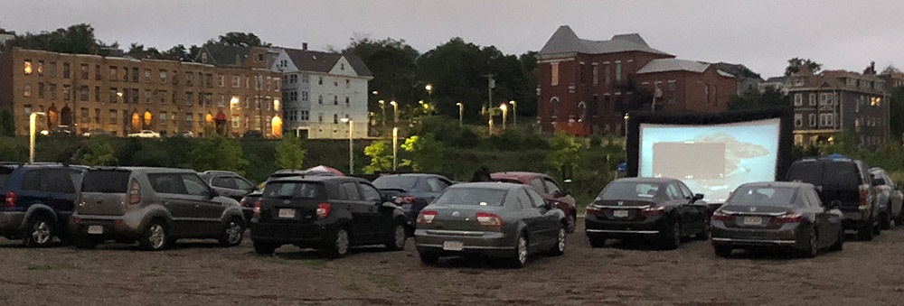 The drive-in movie theater attracts up to 80 people a night.