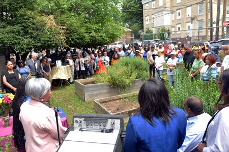 A crowd at the garden dedication