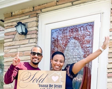 Frandys and her husband celebrate their new home.