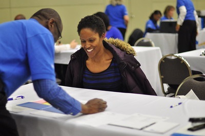 A woman receives help from a housing counselor as she makes sure not to "go it alone."