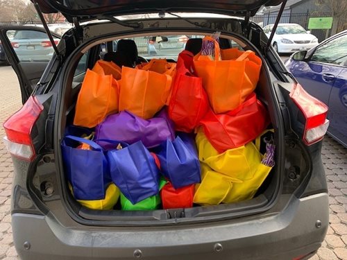 A car filled with food deliveries ready for residents at RUPCO.