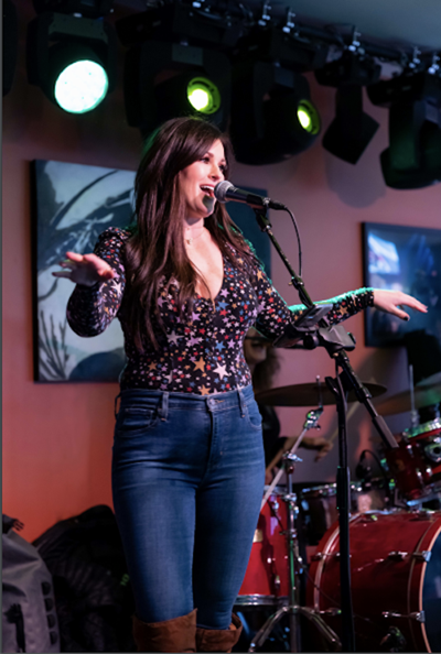 Kerri-Ann Griffith in front of a microphone