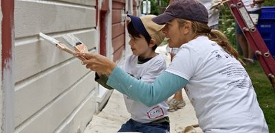 Volunteers paint during NeighborWorks Week