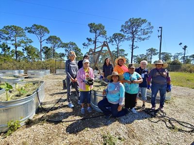 A group of residents who work tending the farm's raised beds.