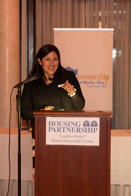 Jessica Padilla-Gonzalez in front of a podium.