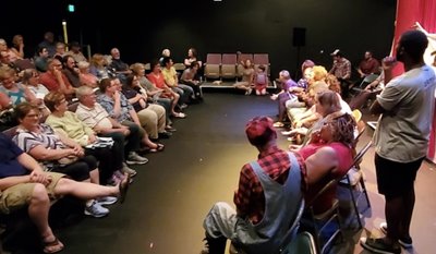 The audience watches the production, pre-pandemic