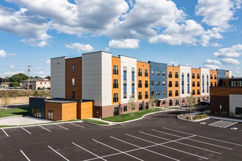 The new Skyview Park Apartments on a sunny day. The building is colorful and looks nothing like the old Sears that it replaced.