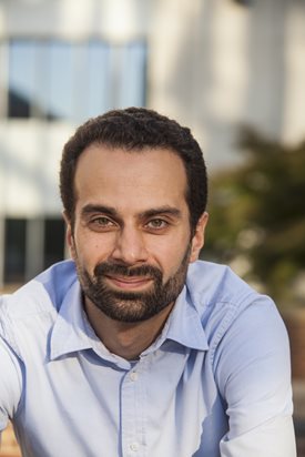 Paul Singh smiles at the camera.