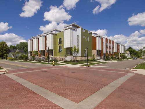 An East Akron development stands against a bright, blue sky.