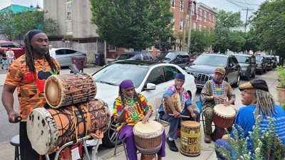 A drum circle at the garden dedication