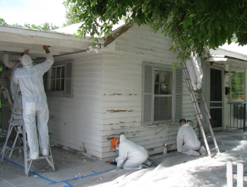 People painting a home.