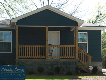 A renovated Columbus Cottage Campaign house painted blue