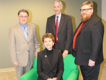 NeighborWorks Green Bay employees Greg Mass, Gail McNutt, Denis Hogan and Noel Halvorsen at Adams Square.