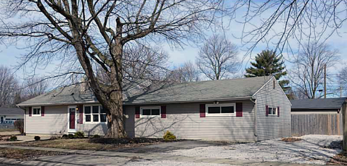 House with white paint and red trim