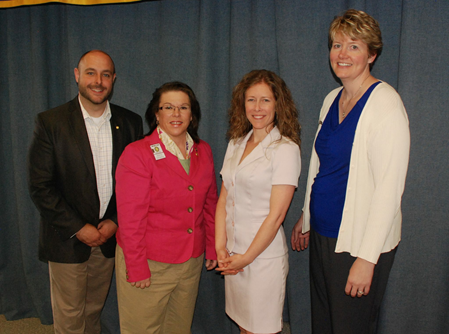 Kara Hay stands among colleagues and peers