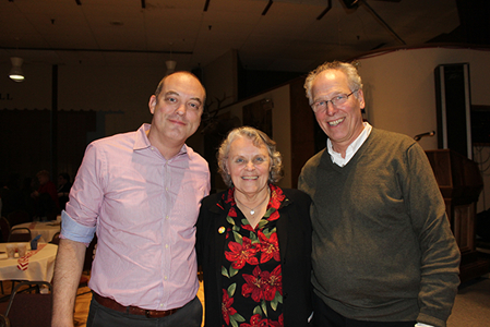 Sheila Rice stands between two NeighborWorks staff at her retirement party