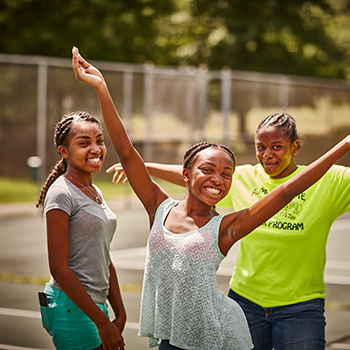 Three girls pose for the camera